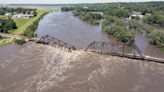 Midwestern flooding collapses a bridge, forces evacuations and kills at least 2