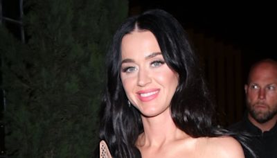 Katy Perry holds hands with Orlando Bloom as they leave American Idol