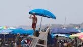 There goes my umbrella! Here's how to stay safe when unexpected storms pop up at the beach