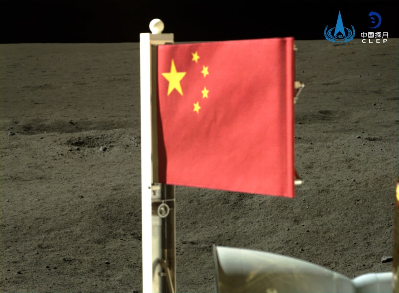 Craft unfurls China’s flag on the far side of the moon and lifts off with lunar rocks to bring home