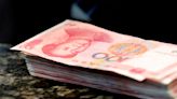 Global investment banks rush to cut yuan forecasts