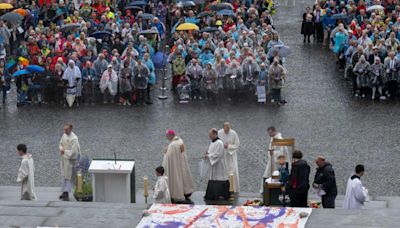 German Catholics celebrate Corpus Christi in rain at conference