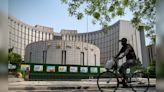 China’s central bank cuts key short-term rate to buoy economy - CNBC TV18