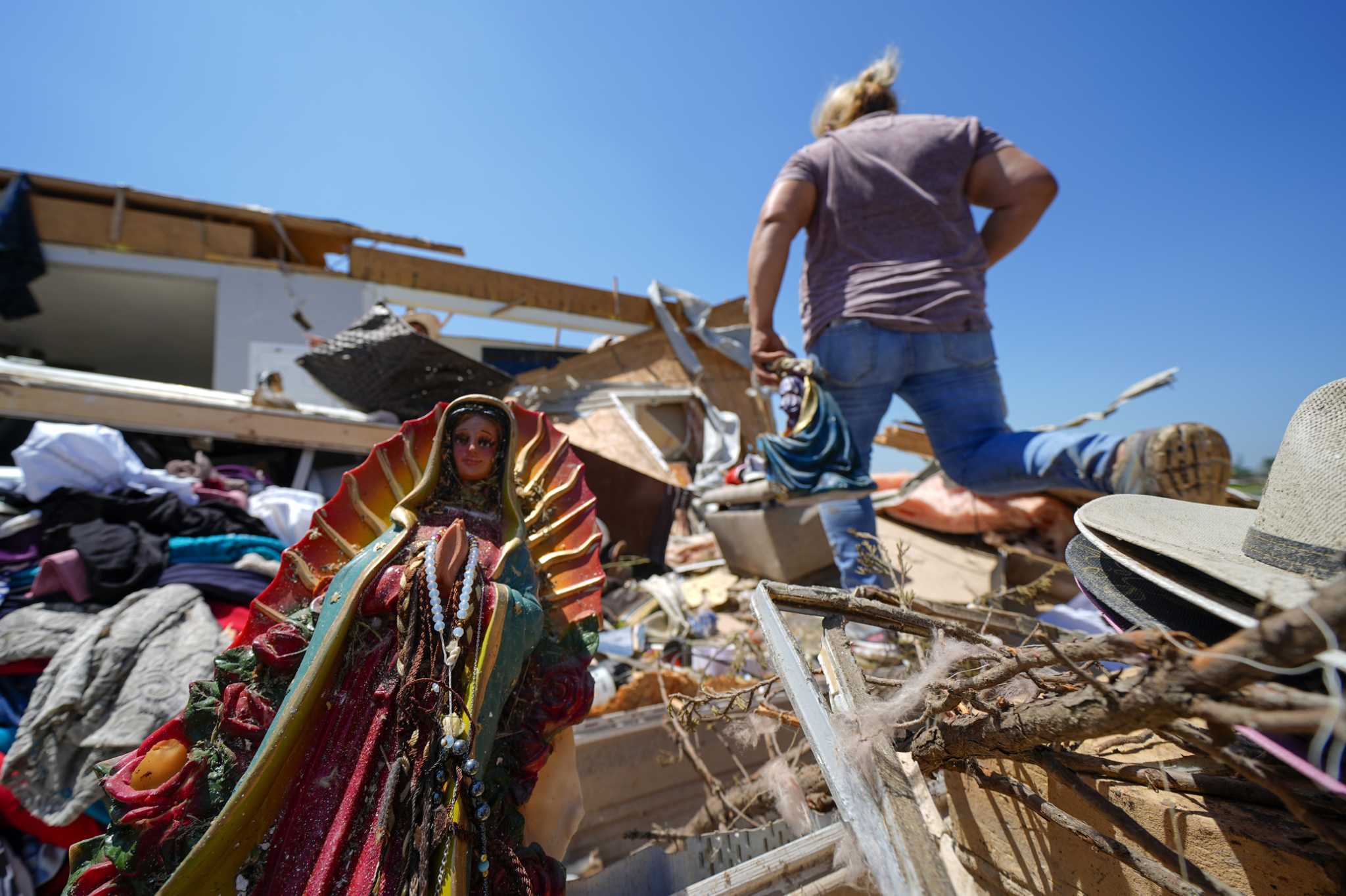 In a north Texas county, dazed residents sift through homes mangled by a tornado