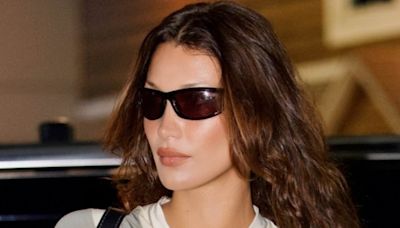 Bella Hadid flashes toned abs in a baby tee during NYC outing