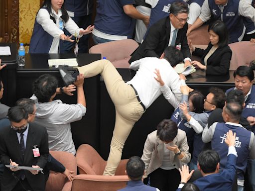 Taiwan’s parliament descends into chaos and punch-ups between MPs in ugly scenes during debate