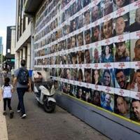 Posters of hostages held by Gaza militants since the October 7 attack on a street in Tel Aviv, Israel's commercial hub