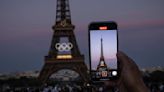 The Olympic rings are mounted on the Eiffel Tower to mark 50 days until the Paris Games