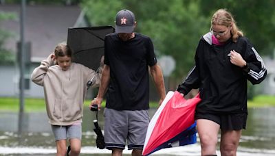 Heavy rains near Houston close schools and flood roadways as officials urge residents to evacuate