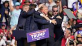 The Latest: Trump calls for unity after apparent assassination attempt
