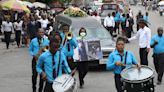 Hundreds mourn gang killings of a Haitian mission director and a young American couple