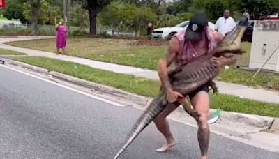 Watch: MMA Fighter Man Handles Large Alligator in the Middle of a Busy Florida Street