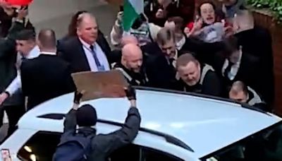 Moment pro-Gaza students harass Jacob Rees-Mogg hurling vicious foul-mouthed abuse as they surround his car while waving Palestinian flags after he gives speech at Cardiff ...