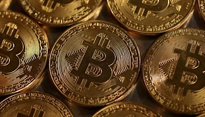 Bitcoin slides below $58,000, rattled by tougher Fed rate outlook
