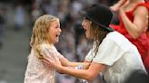 Young Swiftie receiving the 22 hat during the Eras Tour in Hamburg