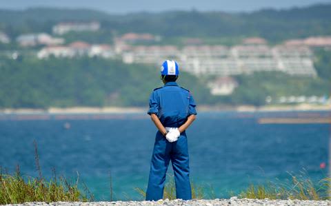 Japan halts material bound for Okinawa airfield project after truck fatality