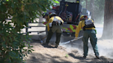 Crews work to stop the spread of the Upper Applegate Fire to nearby properties