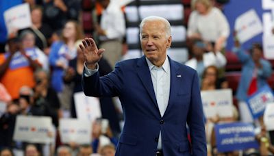 Democratic calls mount for Biden to end campaign, but he vows to fight on