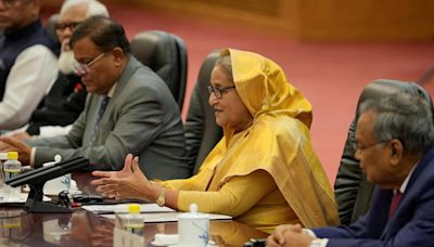 Bangladesh PM Hasina says opposition to blame for deadly unrest, maintains curfew