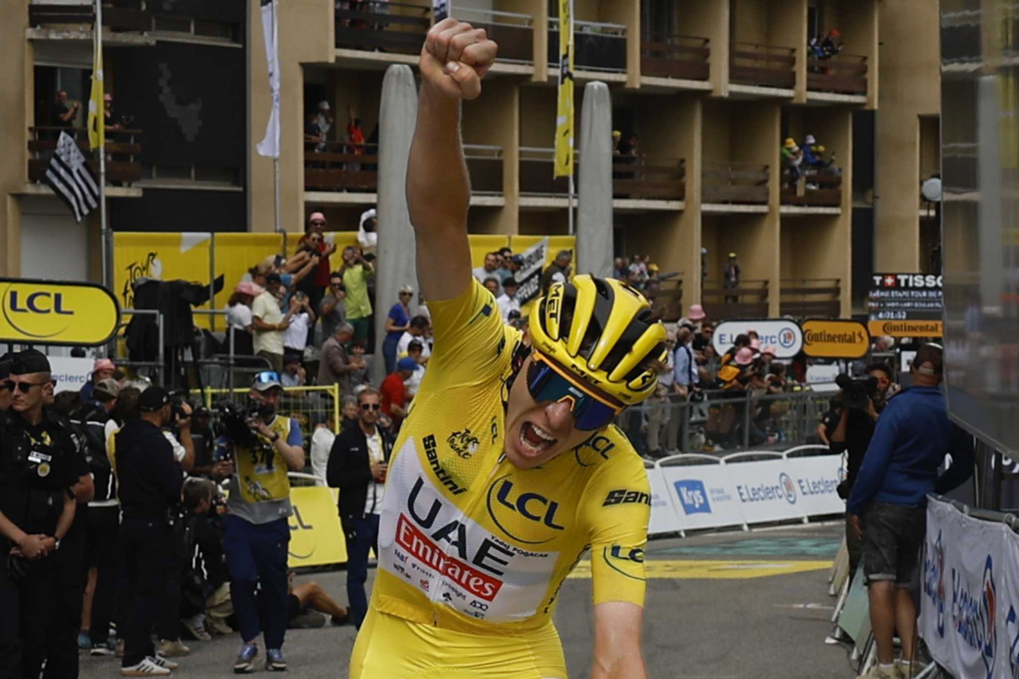 Pogacar wins mountainous 14th stage of Tour de France to extend overall lead over Vingegaard