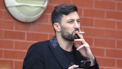 Giovanni Pernice looks downcast as he smokes a cigarette