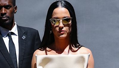 Katy Perry models striking cream dress with folded sides in NYC