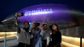 BTS turns 10. Seoul lights up landmarks to celebrate.
