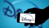 Disney posts profit on streaming for first time but warns of downturn in theme park visits