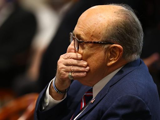 Was Rudy Giuliani Peeing During His Arraignment? You Be the Judge!