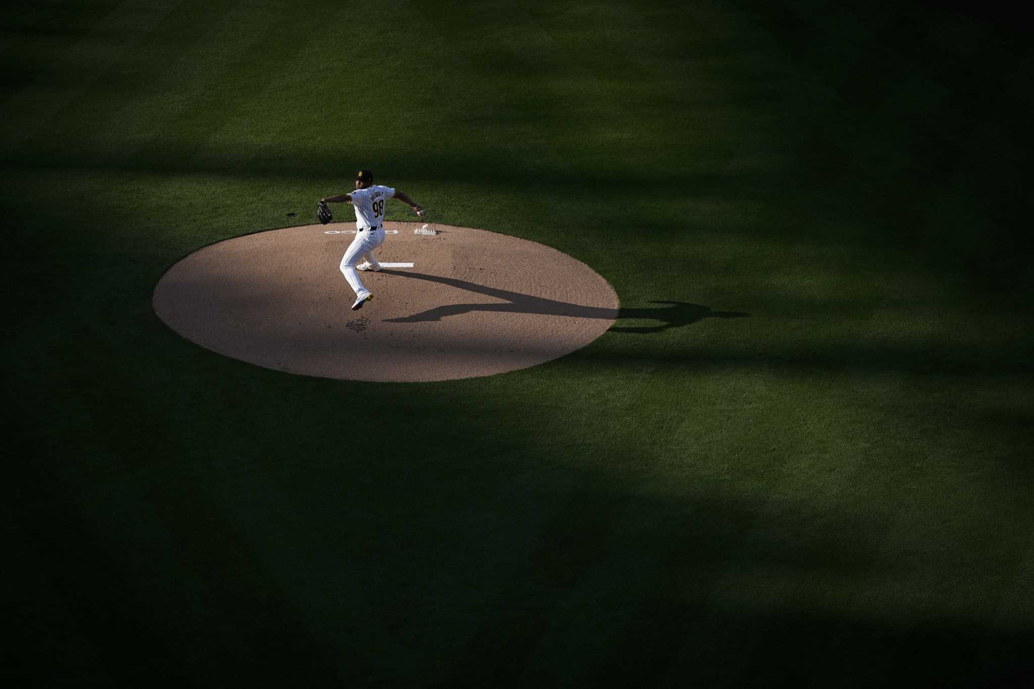 AP Sports Week in Pictures: Pitcher Randy Vazquez, Olympic flame and Nelly Korda's pond splash