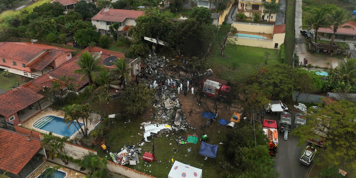 Families of Brazilian plane crash victims gather in Sao Paulo as experts work to identify the dead