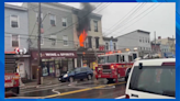 Video: Flames shoot out of window above .99 cent store on Staten Island
