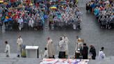 German Catholics celebrate Corpus Christi in rain at conference
