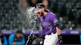 Rodgers' 3-homer game gives Rockies DH split with Marlins