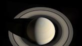 Could the destruction of a large icy moon explain both Saturn’s tilt and its rings?