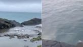 ‘Absolutely stinks’: Beachgoer's disgust as sewage filmed pouring into sea on Cornwall coast