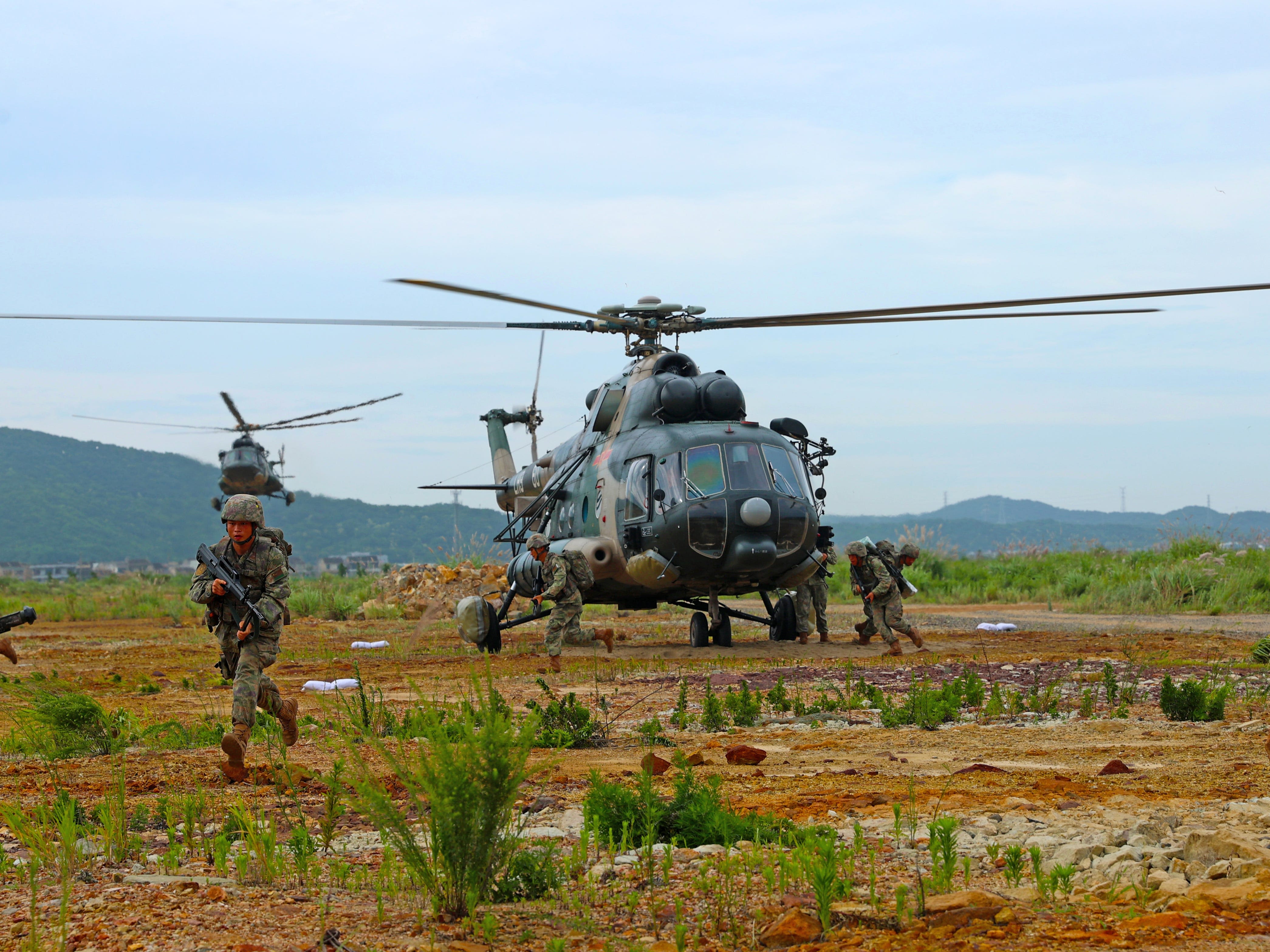 China is gradually amping up its military aggression in a 'boiling frog' strategy, US Indo-Pacific commander says