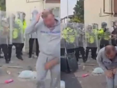 Moment Southport rioter gets instant karma as he is hit by a brick in the crotch and head while taunting police