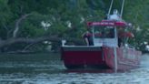 Crews struggle to pull vehicle from Minnesota River in Bloomington