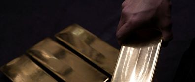 Gold holds ground as investors await US data for rate-cut clues