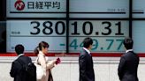 Stock market today: Asian benchmarks mostly slide as investors focus on earnings