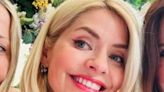 Holly Willoughby beams in rare snap with pals after being defended over 'rough ride'