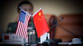 US and China defense chiefs discuss fraught issues in rare meeting