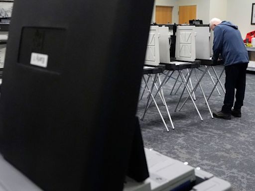 Election officials in battleground Michigan grapple with sweeping voting changes and a presidential election
