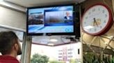 An Iranian man follows the news on a screen in a restaurant in Tehran as state TV reported that a helicopter carrying Iran's president was involved in an accident