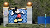 Neo-Nazis Protest Outside Disney World With Swastikas & DeSantis Signs