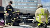 Boston firefighters extinguish fire on Commuter Rail train engine