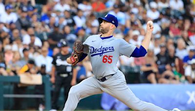 Dodgers weather the storm to take the opener against White Sox