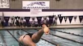 Burlington boys swim team enjoys rare Friday night under the pool lights