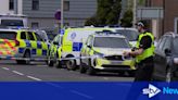 Armed police lock down city street due to 'disturbance'